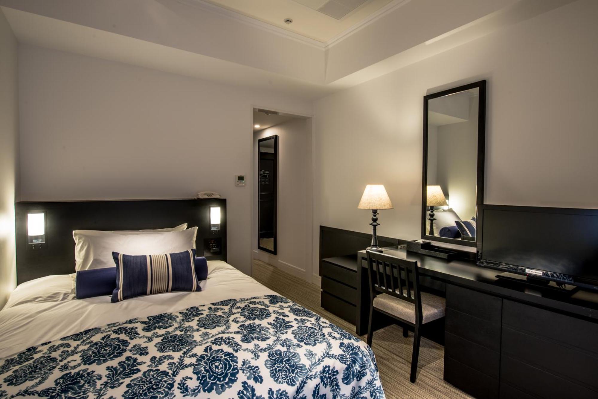 אונה Hotel Monterey Okinawa Spa & Resort מראה חיצוני תמונה A bedroom at the hotel